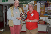 Julian recieving the Canadian Trophy from Harriet